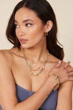 Load image into Gallery viewer, NatalieBJewelry-Uma-Gold-Hoops-Model
